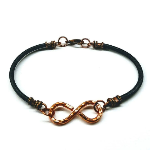 The Masculine Sturdy Copper Swivel Infinity Bracelet by Alexa Martha Designs features a hammered copper infinity symbol, copper rings, and a lobster clasp for a timeless, durable style.