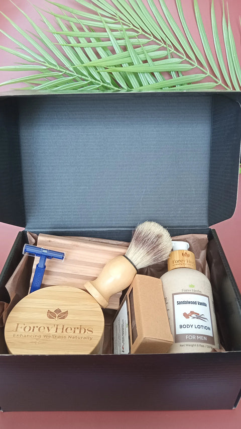 The Forev'Herbs Men's Grooming Gift Set includes a razor, shaving brush, wooden bowl, handmade soap, sandalwood vanilla body lotion, wooden comb, cedarwood shaving cream, and a green palm leaf for an elegant touch.