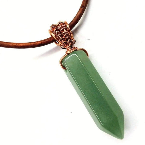 The Alexa Martha Designs Mens Rustic Wire Wrapped Pointed Gemstone Crystal Leather Necklace features a green pendant wrapped in copper on a brown leather cord, creating vegan-friendly crystal jewelry.