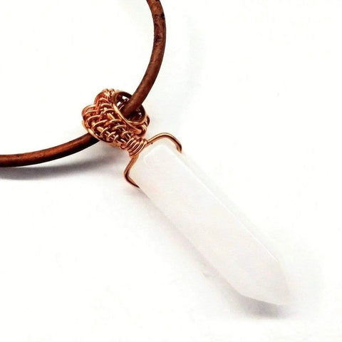 The Alexa Martha Designs Mens Rustic Wire Wrapped Pointed Gemstone Crystal Leather Necklace features a handcrafted white crystal pendant on a brown leather cord, beautifully displayed against a white background.