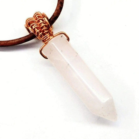The Mens Rustic Wire Wrapped Pointed Gemstone Crystal Leather Necklace by Alexa Martha Designs features a clear crystal pendant on a brown leather cord—ideal for those seeking vegan-friendly jewelry.