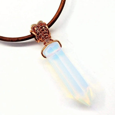 The Mens Rustic Wire Wrapped Pointed Gemstone Crystal Leather Necklace by Alexa Martha Designs features a handcrafted iridescent crystal wrapped in copper wire on a leather cord, showcasing vegan-friendly elegance against a white background.