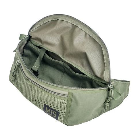 The MIS Mesh Waist Bag - Camo Green, made of water-resistant Cordura Nylon, features a zippered main compartment, inner strap, mesh front pocket, and MIS label. Shown empty on a white background.