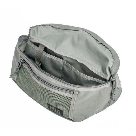 The MIS Mesh Waist Bag - Foliage is a light gray, water-resistant Dupont Cordura Nylon pouch with an open top, mesh front pocket, internal divider, and a small MIS label on the mesh. Displayed empty on a white background.
