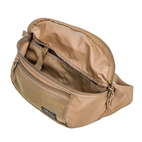 The MIS Mesh Waist Bag in Coyote Brown is made from durable Cordura Nylon, featuring a spacious main compartment, mesh front pocket with visible MIS logo patch, zipper closures, and a roomy interior.
