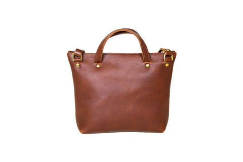 The Quinn Crossbody by Urban Southern is a premium leather handbag with short handles and gold-tone hardware, made in America and shown against a plain white background.