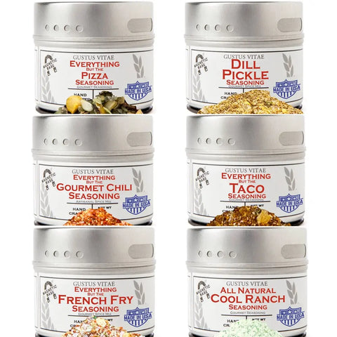 The Gustus Vitae Midwestern Classic Seasonings Collection features six tins—Pizza, Dill Pickle, Gourmet Chili, Taco, French Fry, and Cool Ranch—each with a silver lid, white label, and colorful seasoning inside.