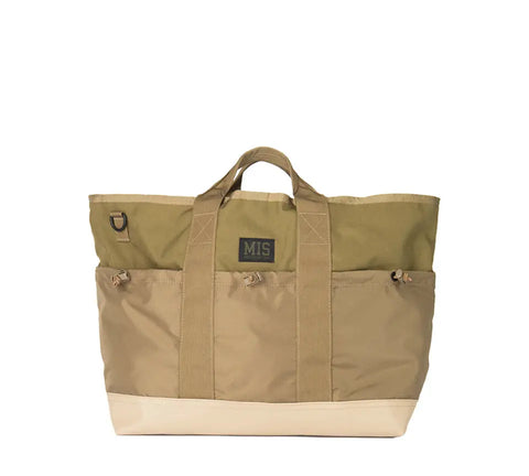 The MIS Multi Pocket Tote Bag - Coyote Tan features sturdy handles, front pockets, a central rectangular logo patch, and is crafted from durable Cordura nylon for lasting quality in a minimalist design.