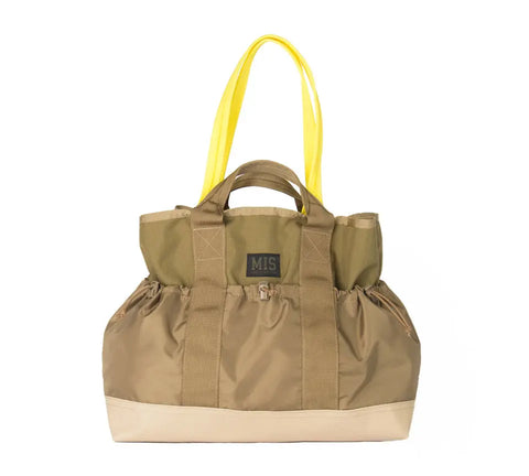 The MIS Multi Pocket Tote Bag - Coyote Tan features durable Cordura nylon, two yellow shoulder straps, tan handles, multiple exterior pockets, a sturdy base, a front MIS label, and is proudly made in the USA.