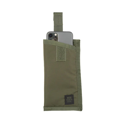 The MIS Tactical Key Strap Set - Olive features a green, water-resistant pouch with velcro strap, durable MIL-SPEC nylon webbing, and a black label that reads MIS Made in USA, shown holding a smartphone partially inside.