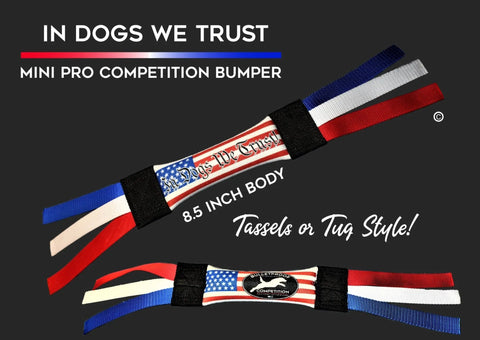 A promo image for Bulletproof Pet Products’ Mini Dock Diving Bumper Tug - Competition Series features two floating tugs with red, white, and blue tassels, USA flag design, and “IN DOGS WE TRUST” plus “8.5 INCH BODY, Tassels or Tug Style!”.