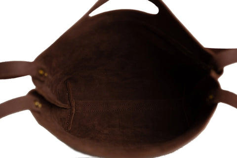 See inside the American-made Urban Southern Mini Market Tote, featuring two handles, a roomy unlined interior, and a small stitched side pocket.