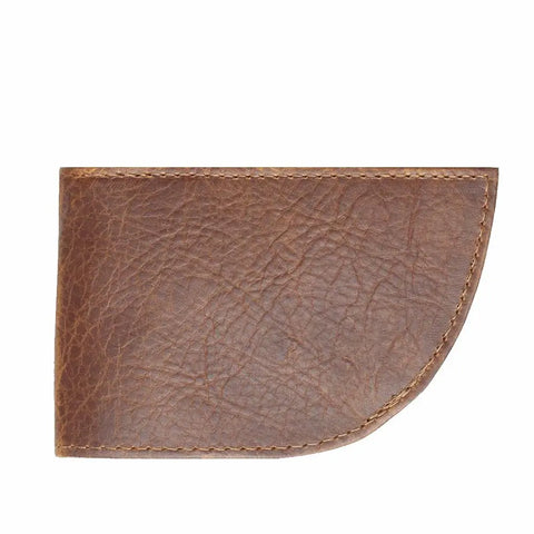 The Nantucket Bison Leather Front Pocket Wallet by Rogue Industries is a brown wallet with visible grain texture, edge stitching, and a curved lower right corner.