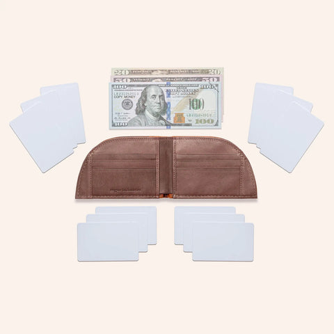 The Rogue Industries Rogue Front Pocket Wallet - Classic Made in Maine Edition, a brown RFID-blocking leather wallet, is shown unfolded and empty with blank white cards and U.S. bills ($100, $50, $20) on a light background.