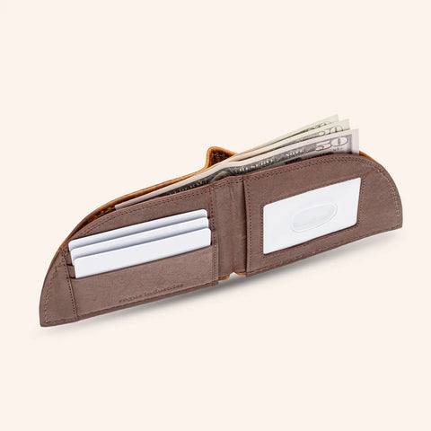 The Rogue Industries Rogue Front Pocket Wallet - Classic Made in Maine Edition, shown on a light background, features premium brown leather, RFID-blocking technology, a clear ID slot, card slots, and paper currency space in a sleek front-pocket design.