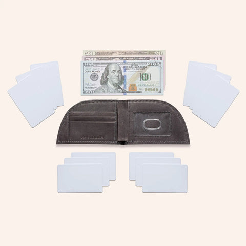 An open Rogue Industries Rogue Front Pocket Wallet - Classic Made in Maine Edition is surrounded by blank white cards. Above it are four U.S. bills ($20, $50, $100), with more blank cards below and on each side of the wallet.
