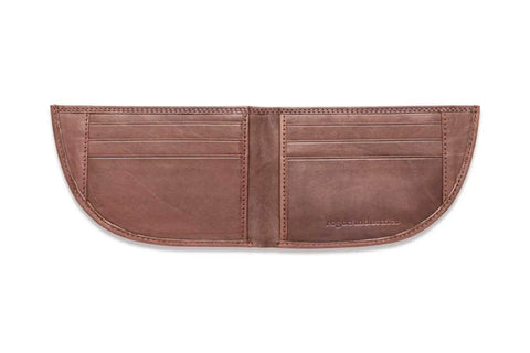 The Rogue Industries Nantucket Front Pocket Wallet is a brown top-grain leather wallet with curved edges, multiple card slots on both sides, visible edge stitching, and the brand name embossed on the lower right.