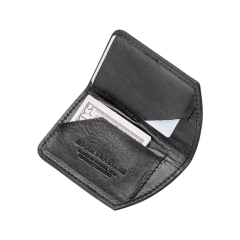 The Minimalist Wallet by Rogue Industries is a black leather slim wallet, embossed and open to display a cash bill and credit card inside, set against a plain light background.
