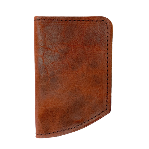 The Minimalist Wallet by Rogue Industries is a brown leather wallet with visible edge stitching, shown closed against a plain background.