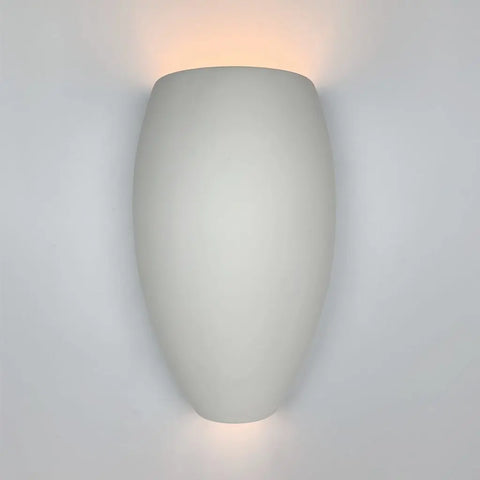 The Modern USA-Made Wall Lighting – Aruba Sconce by A19 Artisan Lighting features a smooth, oval design that casts soft up and down light—handcrafted in California and perfect for contemporary spaces.