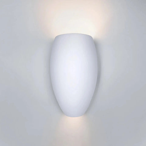 The Aruba Sconce by A19 Artisan Lighting is a modern, USA-made wall light with an oval white design that softly illuminates your wall upward and downward. Handcrafted in California for the Islands of Light Collection.