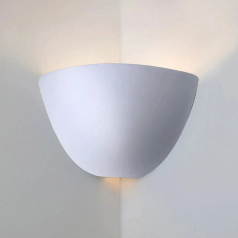 The Gran Aegina Corner Sconce by A19 Artisan Lighting is a modern, handcrafted white wall light made in California, featuring a semi-circular design that mounts at corners and offers up/down soft lighting. Compatible with LED smart bulbs for customizable effects.