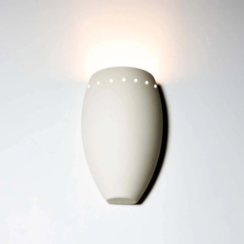 The Modern USA-Made Grenada Sconce by A19 Artisan Lighting is a handcrafted white ceramic wall fixture with top circular cutouts that casts soft upward light. Its LED smart bulb compatible for energy-efficient illumination. Made in California.