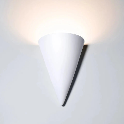 The Modern USA-Made Wall Lighting – Icelandia Sconce by A19 Artisan Lighting is a handcrafted, upside-down white cone sconce that emits soft upward light for a glowing wall effect. Perfect for use with LED smart bulbs to customize your ambiance.
