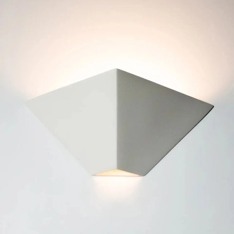 The Modern USA-Made Wall Lighting – Java Sconce by A19 Artisan Lighting is a handcrafted, matte white wall sconce from California with an inverted pyramid design that emits soft up and down light and pairs well with LED smart bulbs.