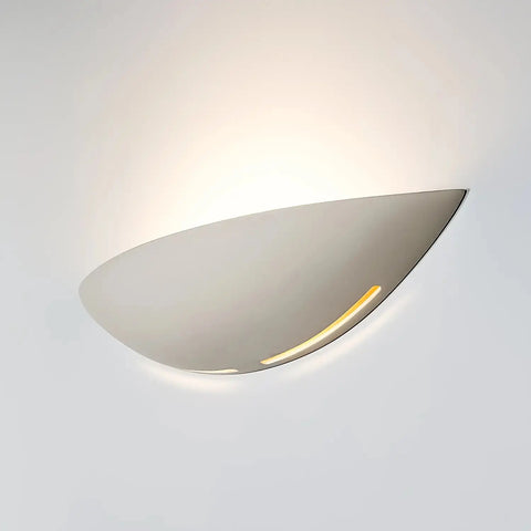 The Kauai Sconce by A19 Artisan Lighting is a handcrafted, modern wall fixture made in California with a smooth white finish. It emits a warm upward glow and supports LED smart bulbs for versatile use and lasting USA-made quality.