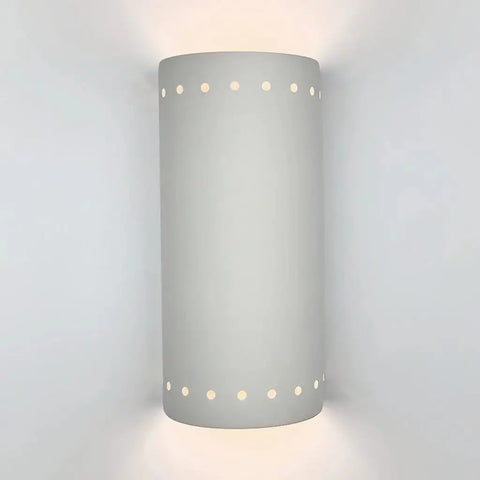 The Kythnos Sconce by A19 Artisan Lighting is a modern, handcrafted wall light made in California, featuring white finish and circular perforations to softly illuminate your wall upward and downward.