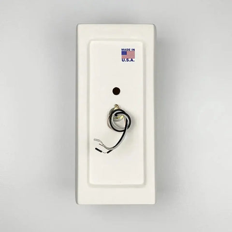 The Kythnos Sconce by A19 Artisan Lighting is a rectangular white wall light handcrafted in California, featuring a central hole with exposed wires and a MADE IN U.S.A. sticker with an American flag.