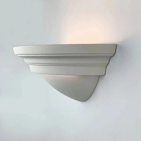 The Majorca Sconce by A19 Artisan Lighting is a modern, handcrafted ceramic wall fixture made in California, featuring a matte white finish that casts soft upward light—perfect for adding elegant USA-made lighting to any space.