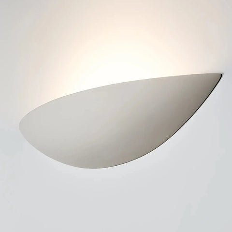 The Maui Sconce by A19 Artisan Lighting is a modern, handcrafted USA-made wall light with a smooth white shade, emitting soft upward light and compatible with LED smart bulbs.