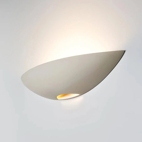 The Oahu Sconce by A19 Artisan Lighting is a modern, USA-made wall light from the Islands of Light Collection, featuring a minimalist half-bowl design that casts soft, ambient upward illumination against any wall. Handcrafted in California.
