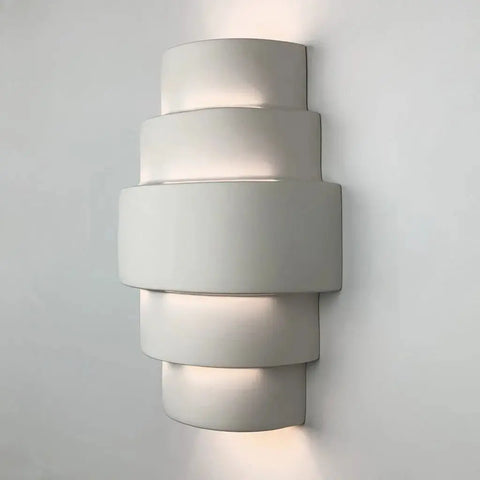 The Modern USA-Made Wall Lighting – San Marcos Sconce by A19 Artisan Lighting, handcrafted in California, features a sleek three-layer design with customizable finishes and energy-efficient LEDs, casting soft up-and-down light for contemporary spaces.