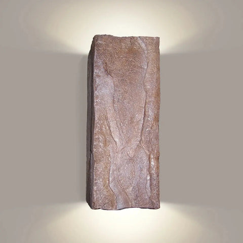 The Modern USA-Made Stone Sconce by A19 Artisan Lighting is a handcrafted rectangular wall fixture from California, designed to mimic textured stone and emit soft up-and-down light. Compatible with an energy-efficient LED Smart Bulb.