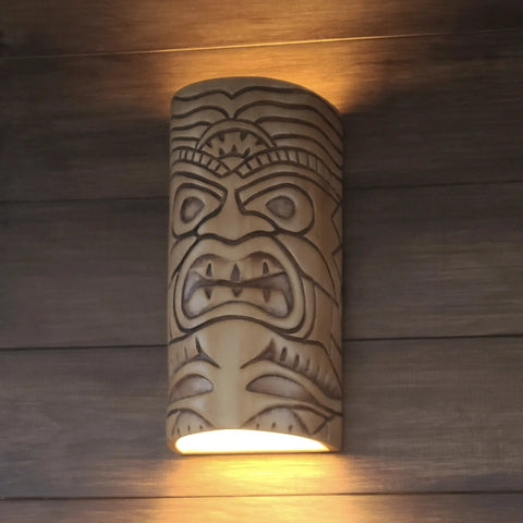 The Modern USA-Made Wall Lighting – Tiki Sconce by A19 Artisan Lighting is handcrafted in California, showcases a carved tiki face, and provides warm up and downlighting with energy-efficient LED smart bulbs.