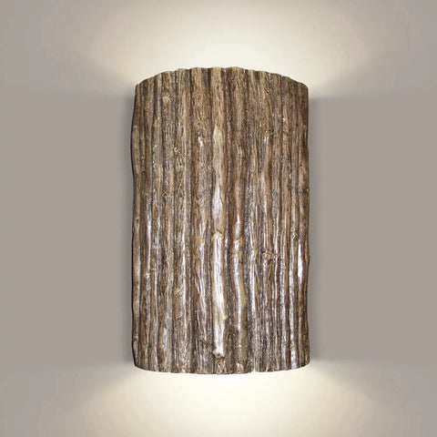 The Modern USA-Made Twigs Sconce by A19 Artisan Lighting features a textured vertical wood grain design in a bronze finish, is LED smart bulb compatible, and casts soft up-and-down light on neutral walls. Handcrafted in California.