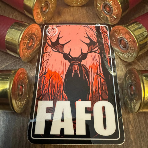 The American Lictor Sticker: Moose - FAFO features a striking moose with antlers in a red-orange forest amid shotgun shells, with bold FAFO text at the bottom.