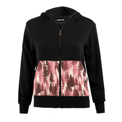 The Mountain Pine hoodie by Fireside Pine is a black zip-up with a hood and long sleeves, made from soft Supima Cotton. It has two large front pockets featuring a pink and burgundy forest tree pattern. Made in the USA.