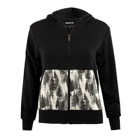 The Fireside Pine Mountain Pine hoodie is a black, made-in-USA zip-up featuring a white lower front panel with a black and gray pine tree forest design, side pockets, a hood, and a front zipper.