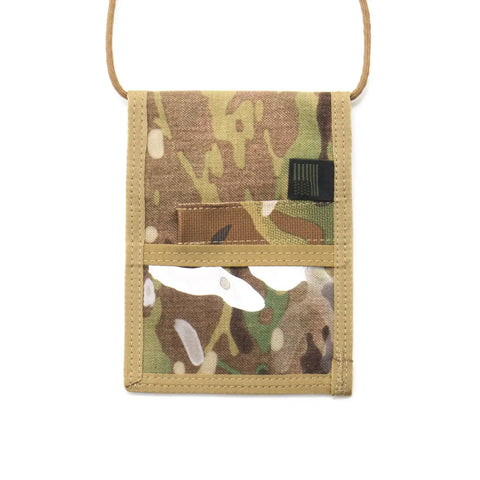 The MIS ID Passport Case - Multi Cam is a durable Cordura nylon neck wallet with a camouflage pattern, tan trim, clear plastic ID window, looped cord, and multiple pockets for cards or travel documents.