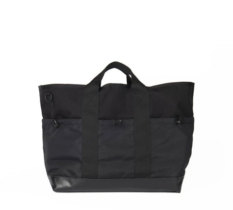 The MIS Multi Pocket Tote Bag - Black, made from Cordura nylon, features short handles, vertical straps, zippered pockets, and a reinforced bottom, shown against a plain white background.
