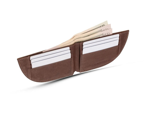 A Rogue Industries Nantucket Front Pocket Wallet in brown moose leather is open on a white background, showing blank cards in its slots and cash. This stylish wallet offers RFID-blocking protection.