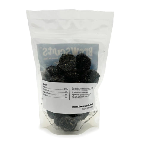 A clear, resealable bag of Blaque by Brewscuits contains dark, round natural dog treats. The white label shows nutrition info and www.brewscuits.com. These tasty snacks also freshen your dogs breath.