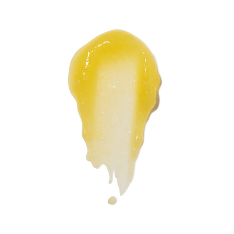 A smooth smear of Naturally London Soothing Balm, 2.7oz—its glossy yellow-white texture on a white background evokes a restorative moisturizer inspired by Japanese skincare.