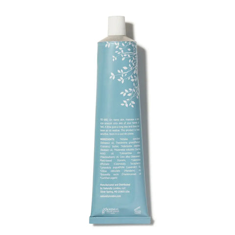 A light blue tube with white floral designs and a white cap, the Naturally London Soothing Balm (2.7oz) displays instructions, ingredients, and manufacturer info on the back—ideal for fans of restorative moisturizers inspired by Japanese skincare.