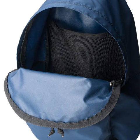 A close-up of the MIS Daypack - Navy, featuring a water-resistant design, a partially unzipped flap, and a black mesh pocket inside the main compartment.