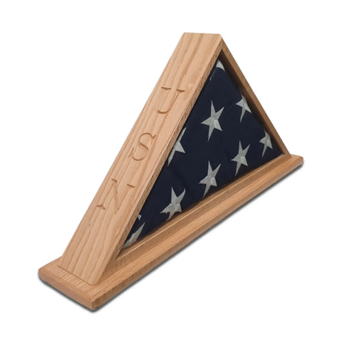 The Legacies of America Woodworking Company Navy Veteran USN Oak Burial Flag Display Case (for 5 x 9.5 flags) features a folded flag with white stars on blue in a triangular wooden case engraved with USN—a tribute to any Navy Veteran.